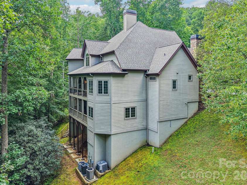 361 Mills River Way, Horse Shoe, NC 28742.  MLS# CAR4423037, YatesRealty ID 50654. Side angle view of the back