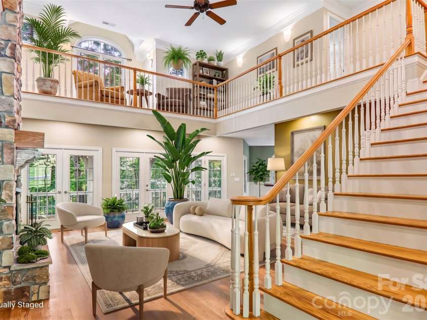 361 Mills River Way, Horse Shoe, NC 28742.  MLS# CAR4423037, YatesRealty ID 50654. Virtually staged great room with natural light and tall ceilings
