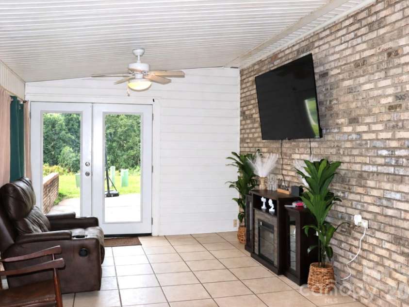 102 King Henry Lane, Granite Falls, NC 28630.  MLS# CAR4411677, YatesRealty ID 50657. Unit 116 Sunroom