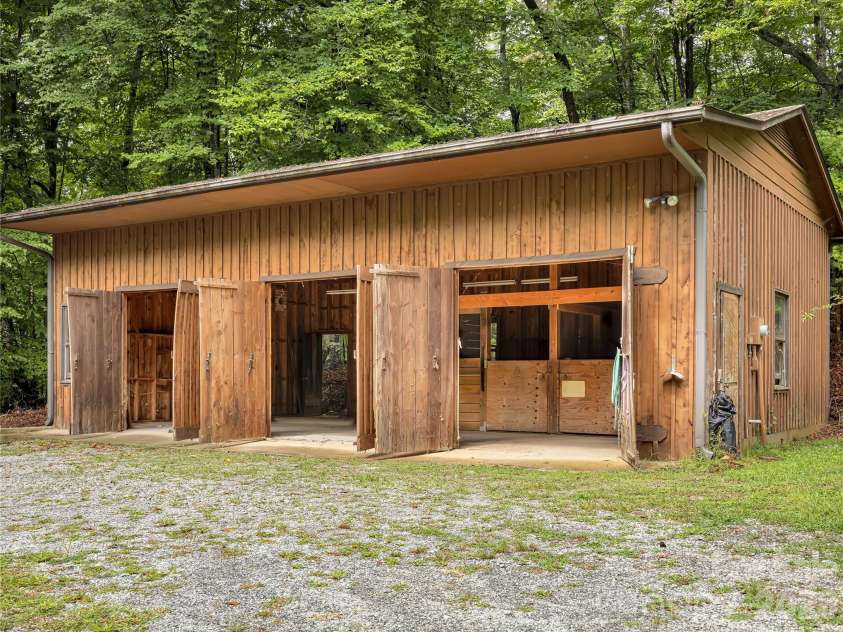 989 Fox Mountain Road, Columbus, NC 28722.  MLS# CAR4423345, YatesRealty ID 50694. 975 square foot barn with three entry bays and two stalls.