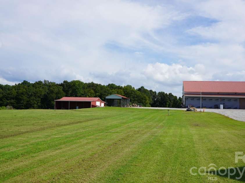 1244 Ross Wright Road, Polkton, NC 28135.  MLS# CAR4421614, YatesRealty ID 50698. Backyard Views