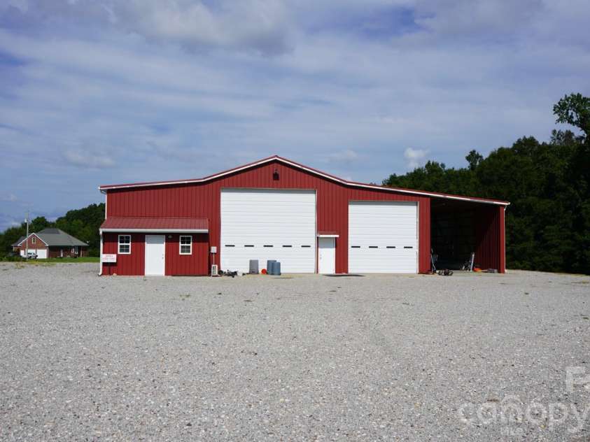 1244 Ross Wright Road, Polkton, NC 28135.  MLS# CAR4421614, YatesRealty ID 50698. Metal workshop w/ office and RV storage