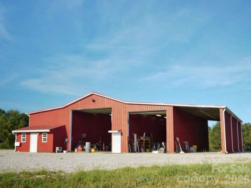1244 Ross Wright Road, Polkton, NC 28135.  MLS# CAR4421614, YatesRealty ID 50698. Red Barn with Doors Open