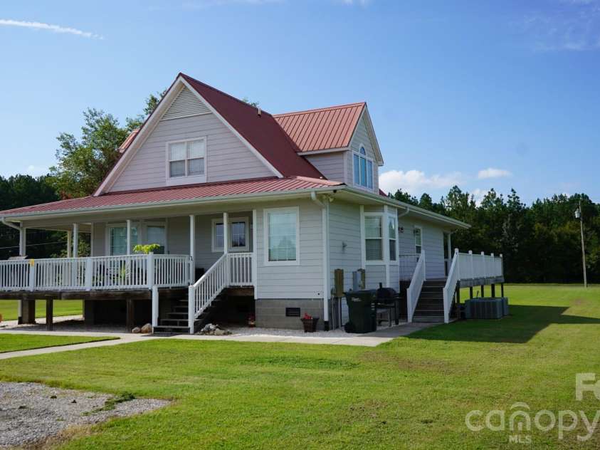 1244 Ross Wright Road, Polkton, NC 28135.  MLS# CAR4421614, YatesRealty ID 50698. Side view of home