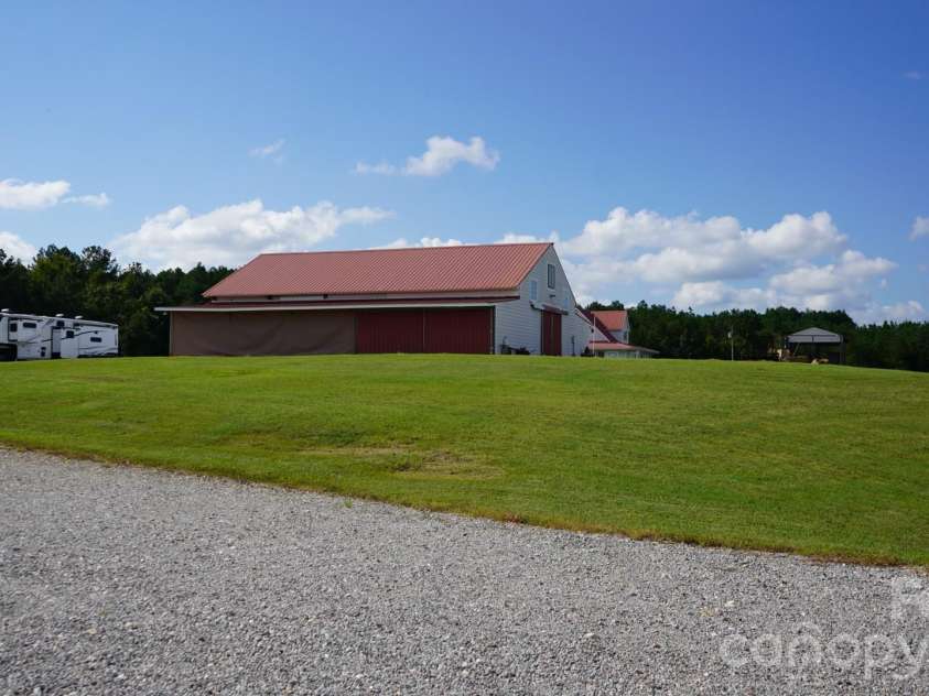 1244 Ross Wright Road, Polkton, NC 28135.  MLS# CAR4421614, YatesRealty ID 50698. White Barn View from Red Barn