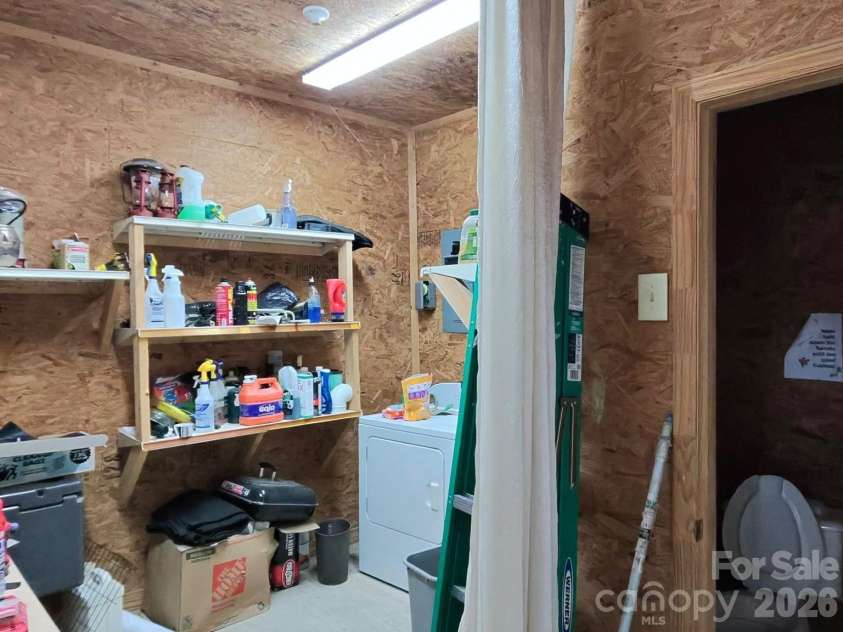 1244 Ross Wright Road, Polkton, NC 28135.  MLS# CAR4421614, YatesRealty ID 50698. White Barn Washer and Half Bath