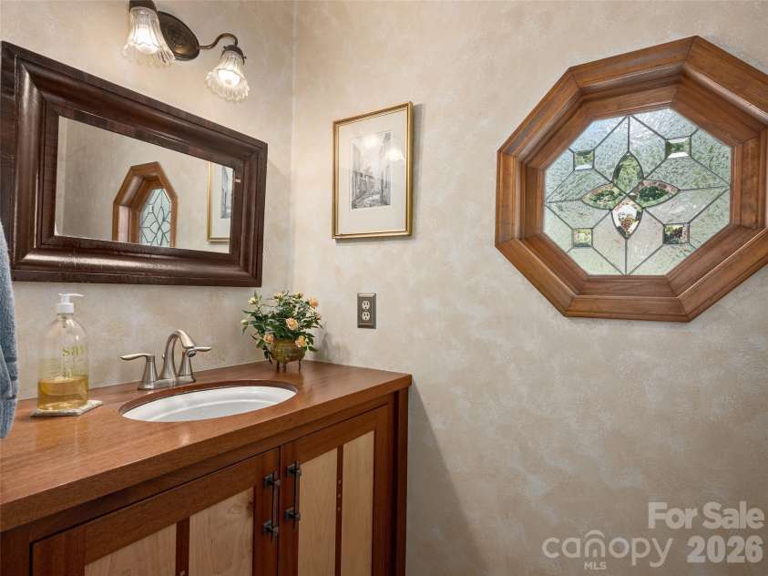 440 Sondley Woods Place, Asheville, NC 28805.  MLS# CAR4423407, YatesRealty ID 50704. Half bath w/updated vanity