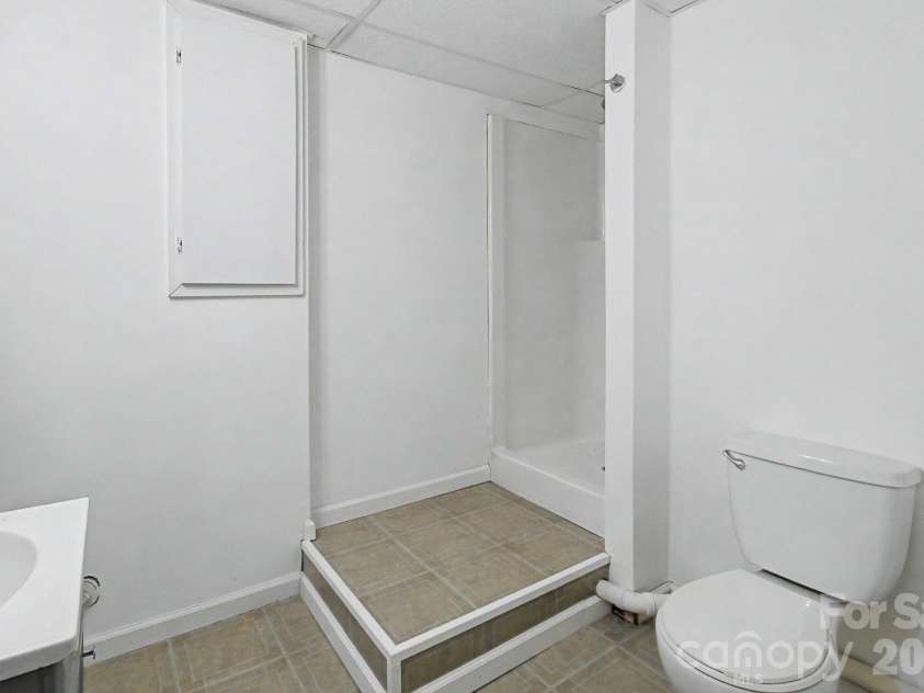 253 Tipton Hill Road, Leicester, NC 28748.  MLS# CAR4423393, YatesRealty ID 50726. Full bathroom in basement