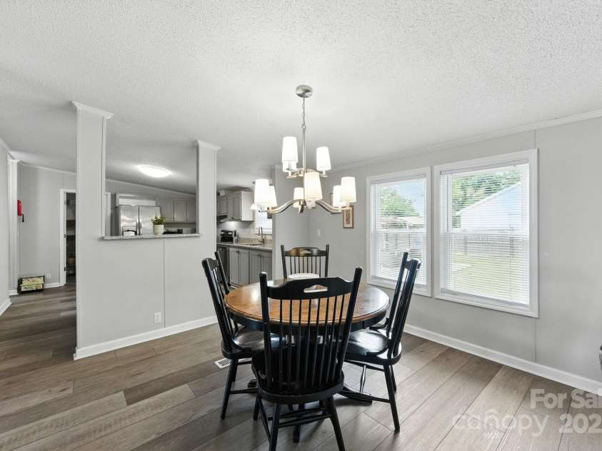1001 Olde Creek Trail, Concord, NC 28025.  MLS# CAR4311037, YatesRealty ID 50739. Dining Area Overlooking Back Yard