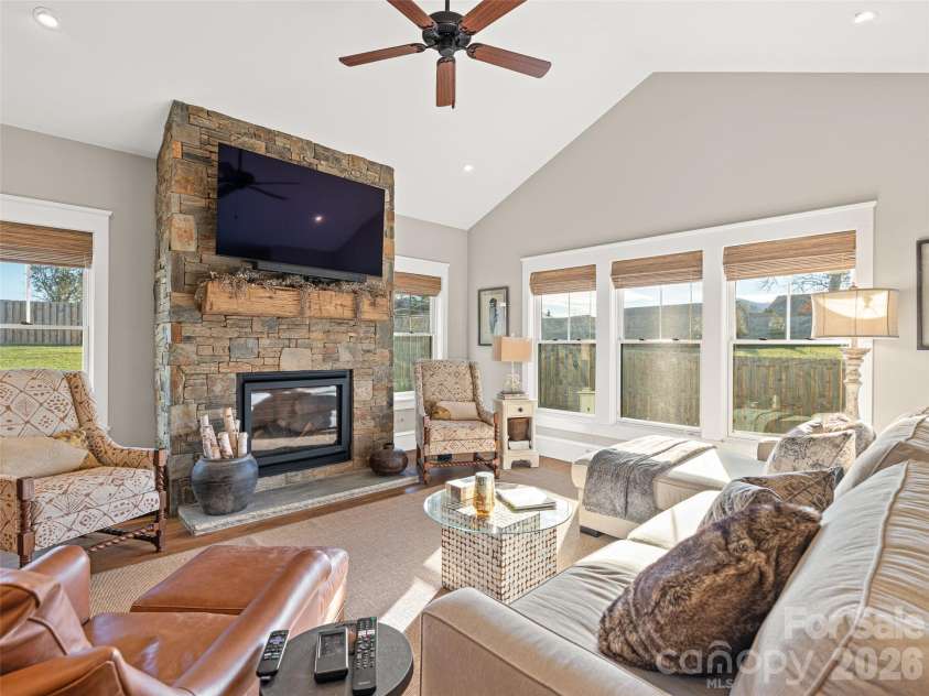 6 Starwood Valley Trail, Arden, NC 28704.  MLS# CAR4424427, YatesRealty ID 50768. Barn timber mantle over fireplace