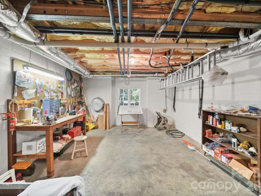 505 Muirfield Drive, Albemarle, NC 28001.  MLS# CAR4424334, YatesRealty ID 50779. Basement Storage/Workshop