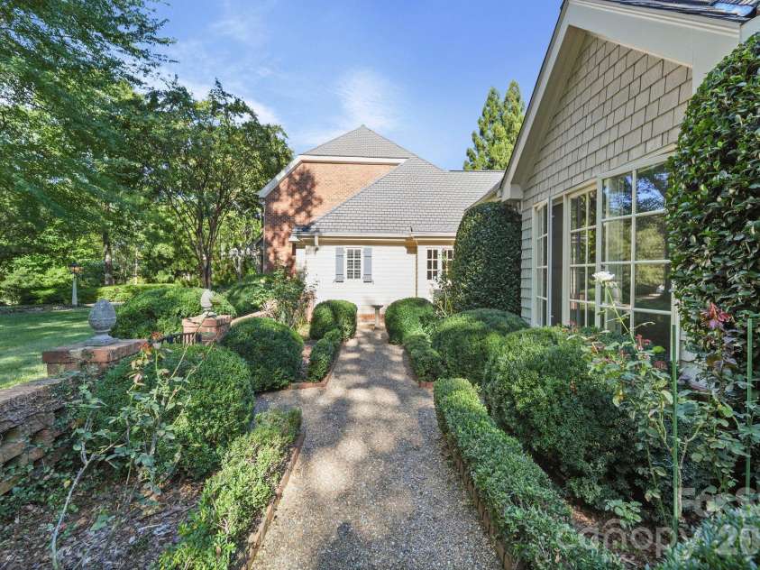 505 Muirfield Drive, Albemarle, NC 28001.  MLS# CAR4424334, YatesRealty ID 50779. Front Lawn and Front Rose Garden