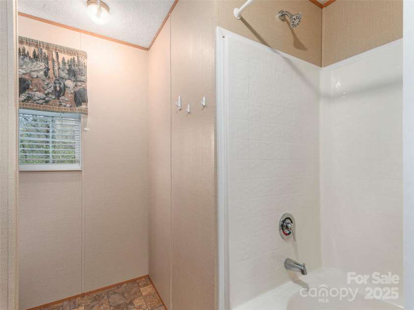 9 Scotty Circle, Candler, NC 28715.  MLS# CAR4242801, YatesRealty ID 5080. Hall Bathroom