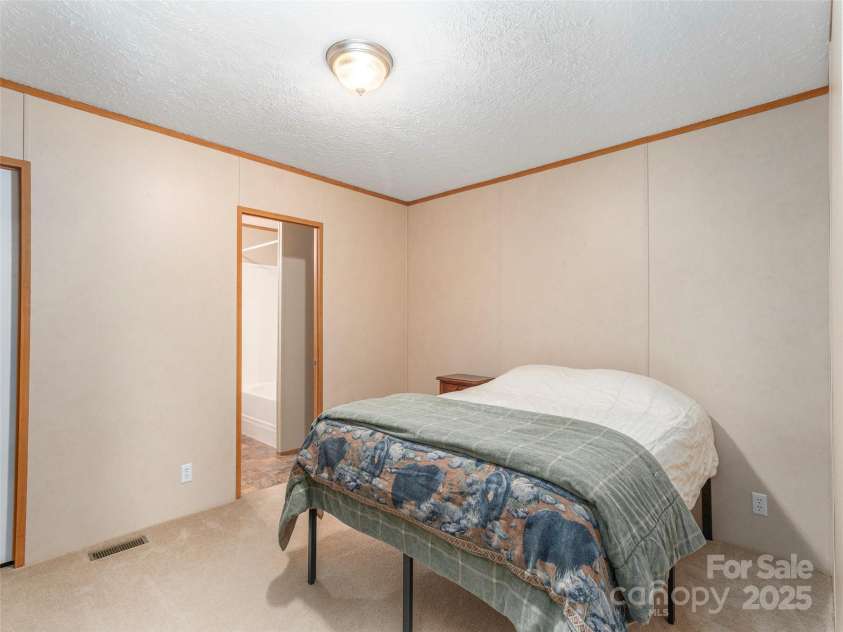 9 Scotty Circle, Candler, NC 28715.  MLS# CAR4242801, YatesRealty ID 5080. Primary Bedroom