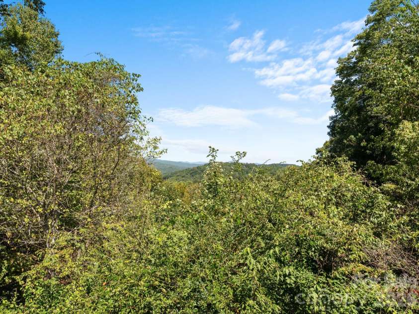 220 Wingfield Way, Brevard, NC 28712.  MLS# CAR4424278, YatesRealty ID 50800. Long range views with more clearing available