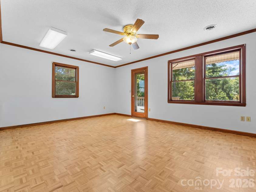 220 Wingfield Way, Brevard, NC 28712.  MLS# CAR4424278, YatesRealty ID 50800. Primary Bedroom with Walkout Deck