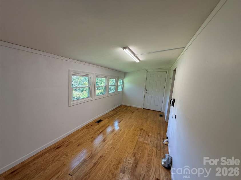44 Oak Hill Road, Nebo, NC 28761.  MLS# CAR4423318, YatesRealty ID 50821. Sunroom/Laundry area
