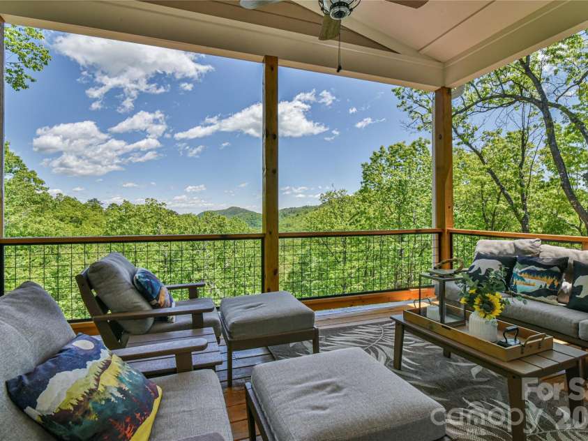 1914 Catawba Falls Parkway, Black Mountain, NC 28711.  MLS# CAR4423489, YatesRealty ID 50822. Large outdoor entertaining deck with long range mountain views.