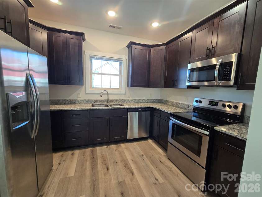 25 Wheeler Road, Weaverville, NC 28787.  MLS# CAR4424215, YatesRealty ID 50846. Kitchen with granite and stainless