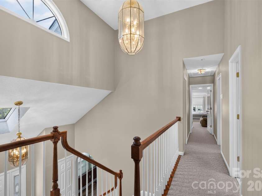 69 Sunwest Drive, Arden, NC 28704.  MLS# CAR4424300, YatesRealty ID 50854. Hall above entry foyer, looking toward additional bedrooms