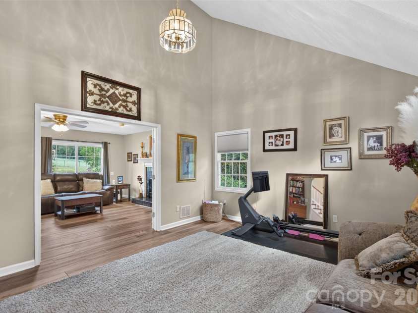 69 Sunwest Drive, Arden, NC 28704.  MLS# CAR4424300, YatesRealty ID 50854. Living Room looking toward Den