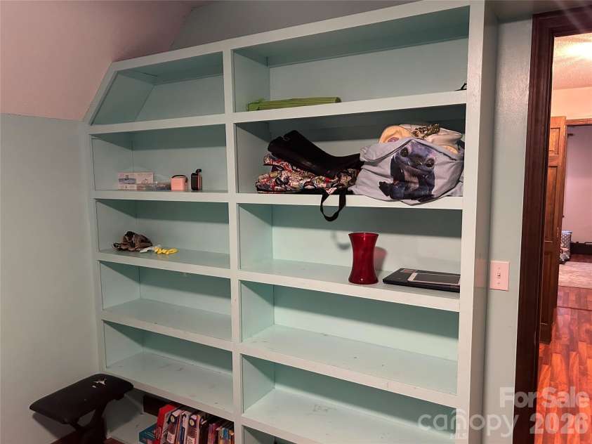1610 Springhaven Circle, Albemarle, NC 28001.  MLS# CAR4424212, YatesRealty ID 50856. Upstairs bedroom built-in shelves