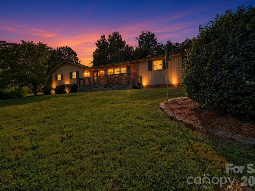 258 Nine Patch Lane, Taylorsville, NC 28681.  MLS# CAR4423574, YatesRealty ID 50868. Side Twilight enhanced