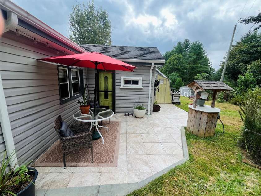 74 Vaughn Road, Spruce Pine, NC 28777.  MLS# CAR4424283, YatesRealty ID 50876. Back patio