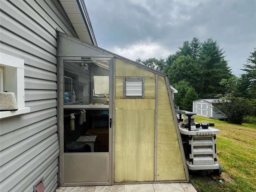 74 Vaughn Road, Spruce Pine, NC 28777.  MLS# CAR4424283, YatesRealty ID 50876. Green House