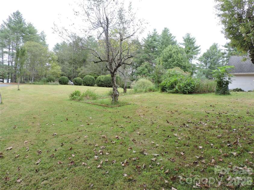 74 Vaughn Road, Spruce Pine, NC 28777.  MLS# CAR4424283, YatesRealty ID 50876. Right side yard