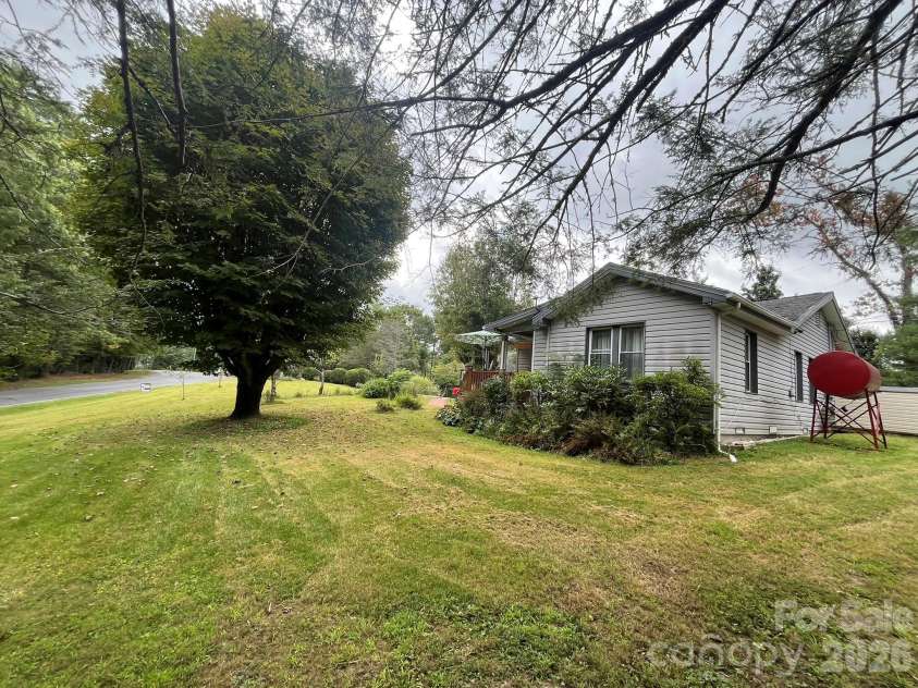74 Vaughn Road, Spruce Pine, NC 28777.  MLS# CAR4424283, YatesRealty ID 50876. Side view of home