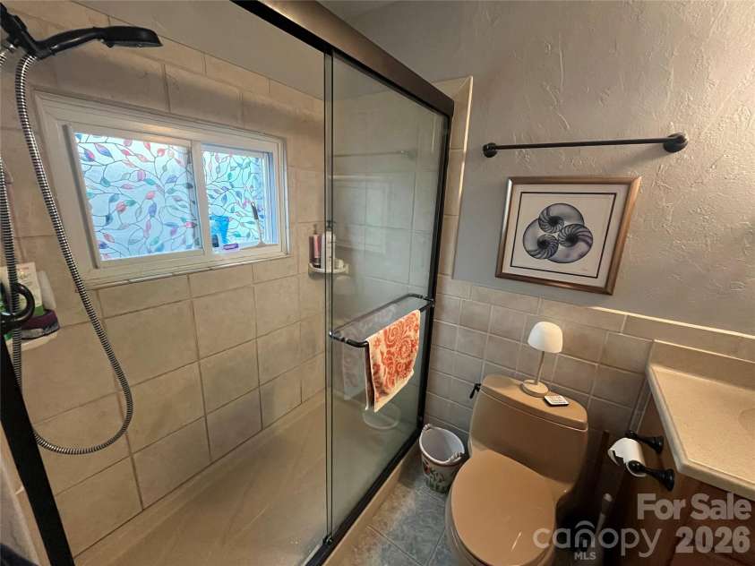 74 Vaughn Road, Spruce Pine, NC 28777.  MLS# CAR4424283, YatesRealty ID 50876. Updated shower!
