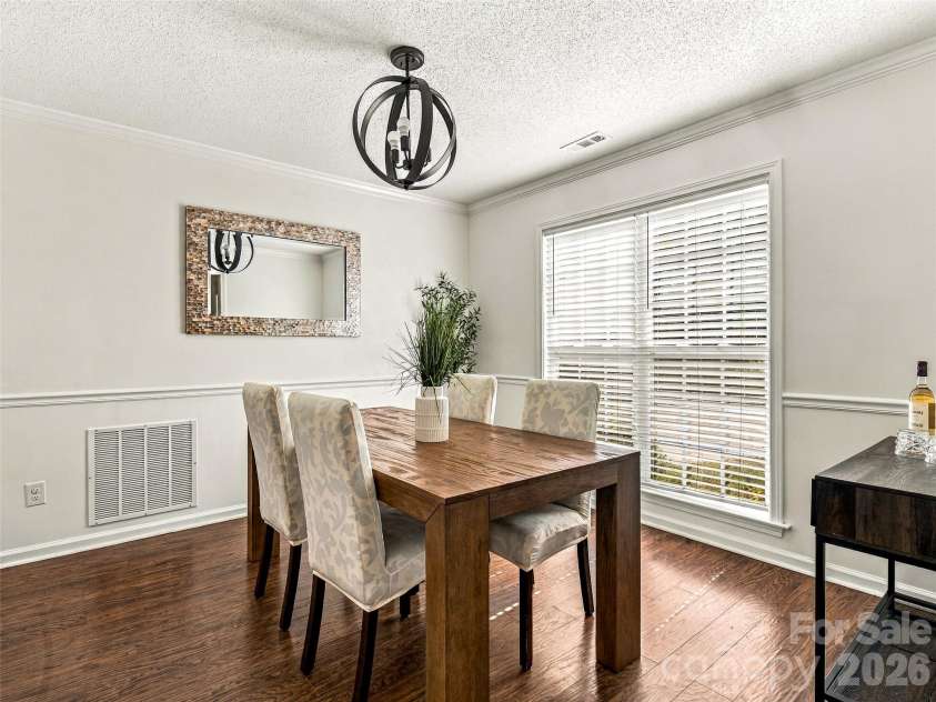 57 Sunberry Trail, Fletcher, NC 28732.  MLS# CAR4424572, YatesRealty ID 50885. Light filled formal dining room.