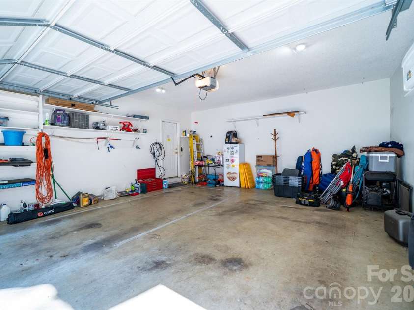 18 Friendly Way, Asheville, NC 28806.  MLS# CAR4423504, YatesRealty ID 50897. 2 car garage with EV charger
