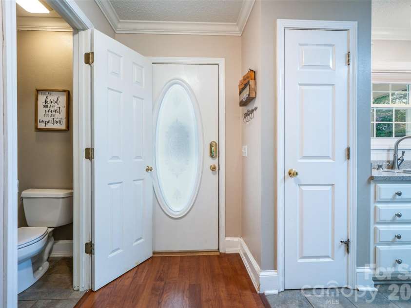 18 Friendly Way, Asheville, NC 28806.  MLS# CAR4423504, YatesRealty ID 50897. View looking at front door and 1/2 bath