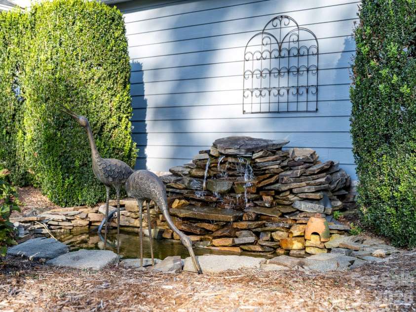 13 Lowry Lane, Weaverville, NC 28787.  MLS# CAR4415194, YatesRealty ID 50910. Babbling pond feature at the front entry.