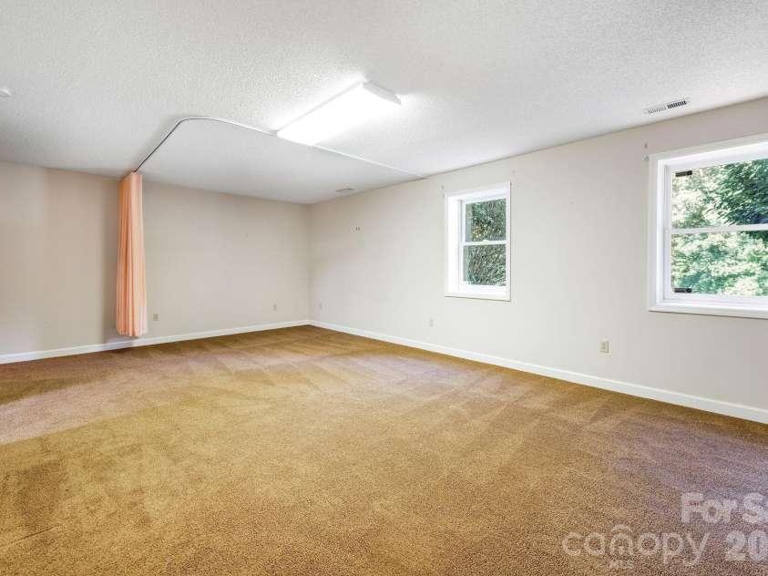 13 Lowry Lane, Weaverville, NC 28787.  MLS# CAR4415194, YatesRealty ID 50910. Finished bonus space.