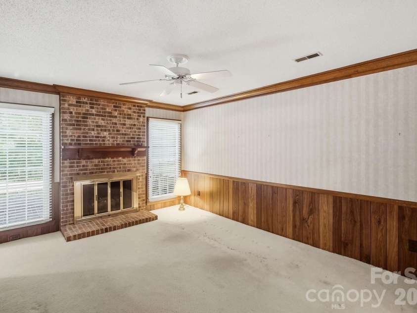 4218 Woodglen Lane, Charlotte, NC 28226.  MLS# CAR4424799, YatesRealty ID 50915. Den w/fireplace