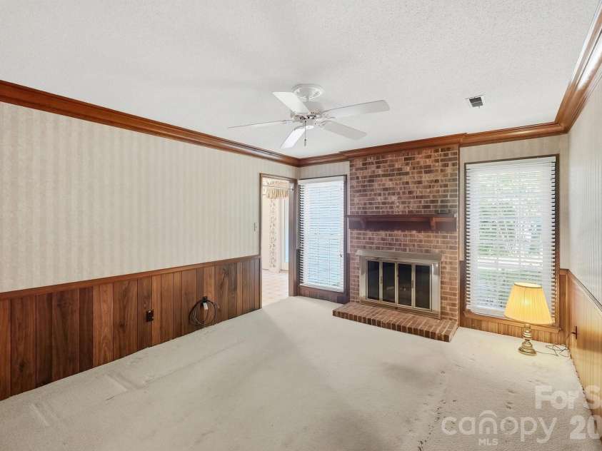 4218 Woodglen Lane, Charlotte, NC 28226.  MLS# CAR4424799, YatesRealty ID 50915. Den w/fireplace