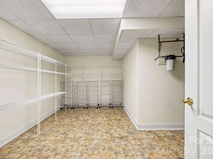 746 Grandview Drive, Concord, NC 28025.  MLS# CAR4434570, YatesRealty ID 5093. Huge utility room for additional storage
