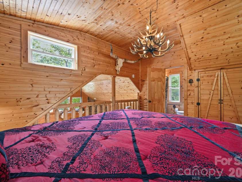1158 Staghorn Road, Purlear, NC 28665.  MLS# CAR4424925, YatesRealty ID 50942. Loft Bedroom with Ensuite Bathroom