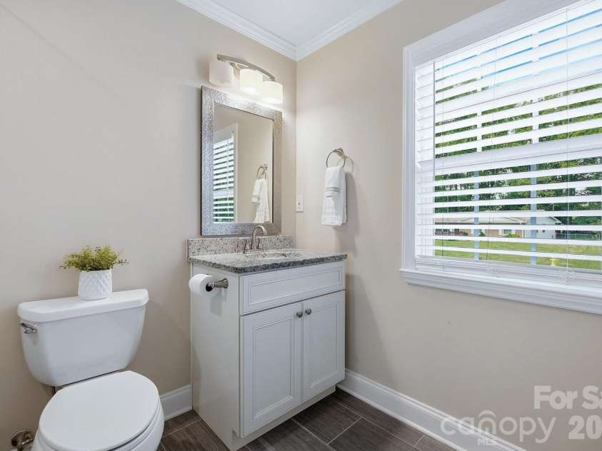 4400 Strangford Avenue, Charlotte, NC 28215.  MLS# CAR4422804, YatesRealty ID 50980. Lower level bathroom