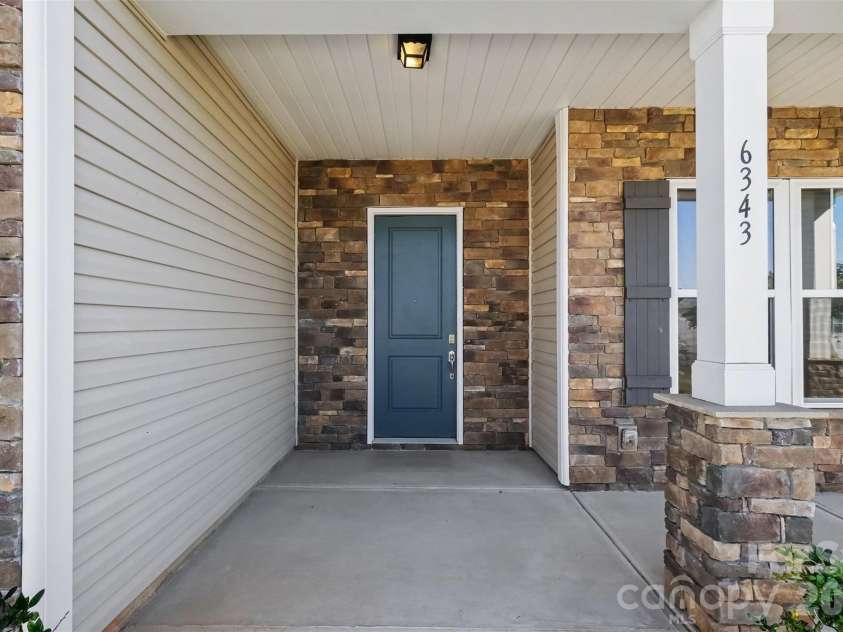 6343 Clarisse Drive, Concord, NC 28025.  MLS# CAR4434568, YatesRealty ID 5104. Covered front porch