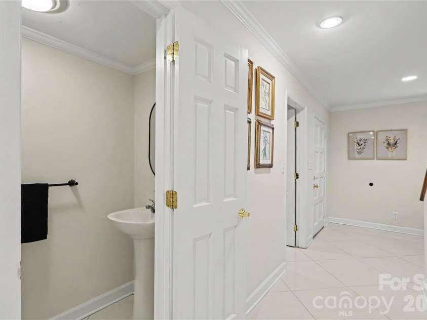 5811 Sharon Road, Charlotte, NC 28210.  MLS# CAR4424078, YatesRealty ID 51040. Hallway and half bath