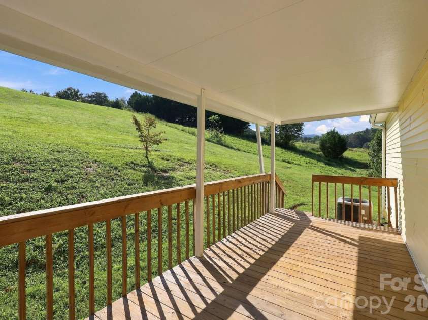 117 Ho Hum Way, Leicester, NC 28748.  MLS# CAR4422890, YatesRealty ID 51054. Back Porch