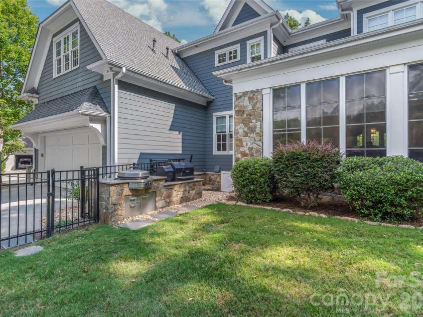 2800 Wintergreen Drive, Charlotte, NC 28211.  MLS# CAR4410831, YatesRealty ID 51056. This outdoor cooking area, designed by Charlotte Grill, features an EVO grill and Yoder smoker