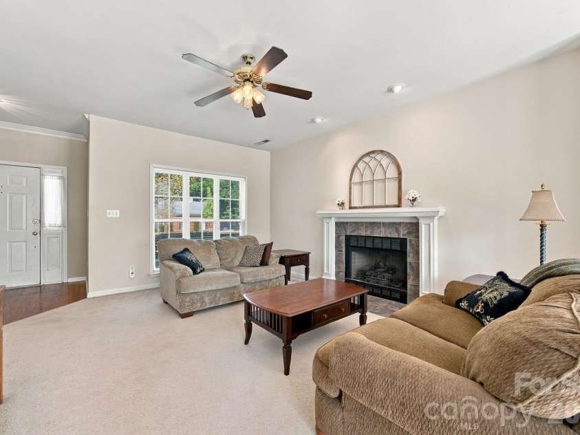 2807 Edgebrook Circle, Matthews, NC 28105.  MLS# CAR4424459, YatesRealty ID 51082. Gas Fireplace with White Mantel