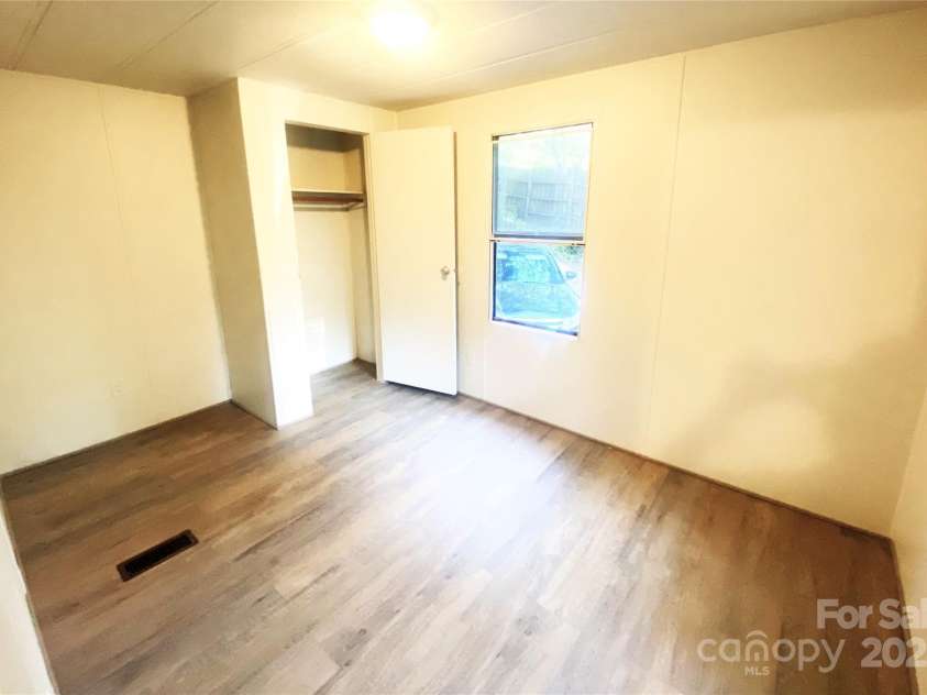 295 Asbury Road, Candler, NC 28715.  MLS# CAR4308375, YatesRealty ID 511. 