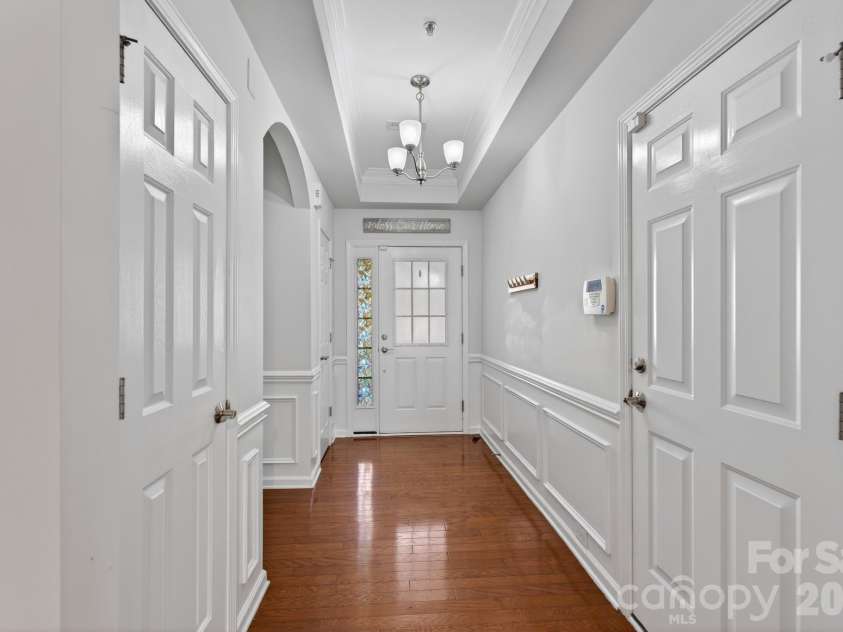 114 Inlet Point Drive, Tega Cay, SC 29708.  MLS# CAR4356533, YatesRealty ID 5112. Foyer view from Living Room