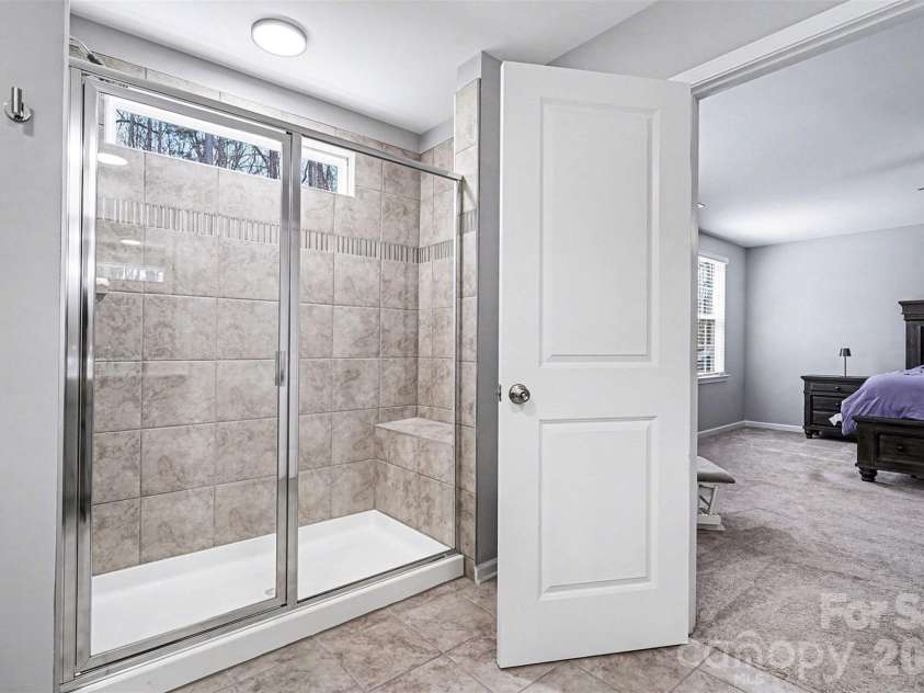 310 Hamptons Cove Road, Troutman, NC 28166.  MLS# CAR4355239, YatesRealty ID 5113. Primary bathroom oversized shower